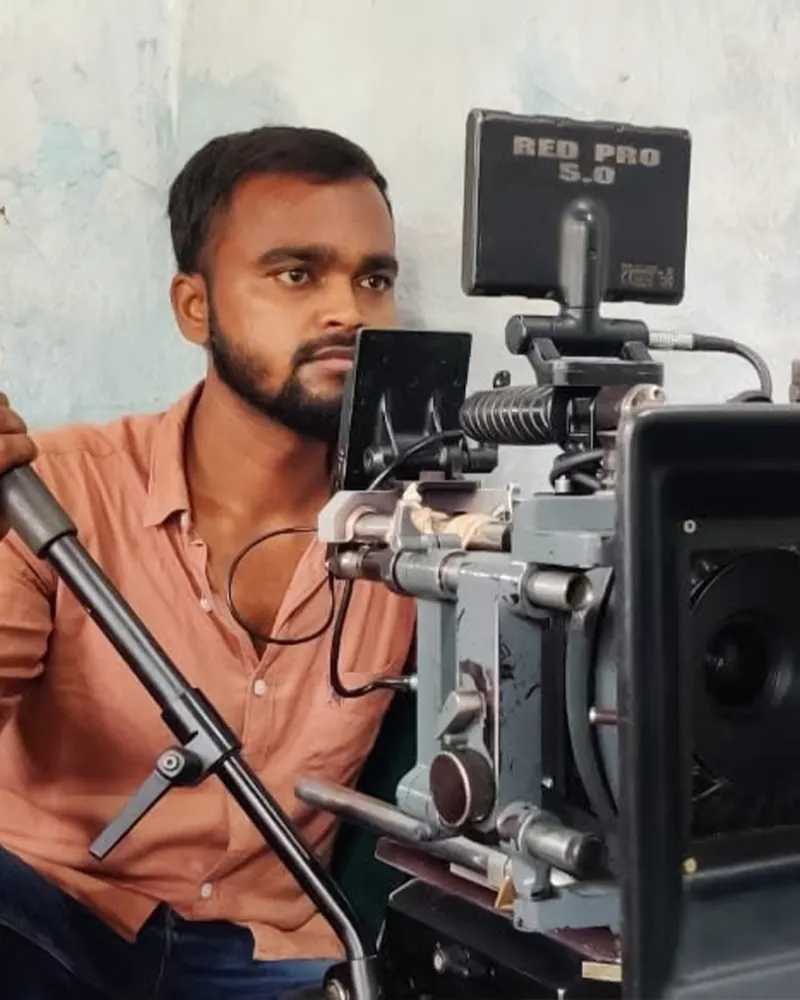 Yuvraj, MDFA cinematography graduate operating RED movie camera on a film set