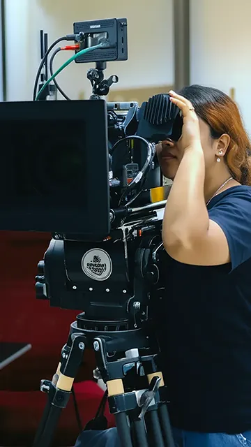 Student filming hands-on with ARRI Alexa camera on set